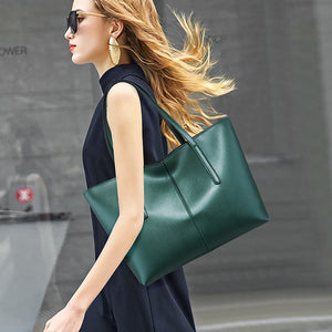 tote in forest green featuring top handles and boxy fit