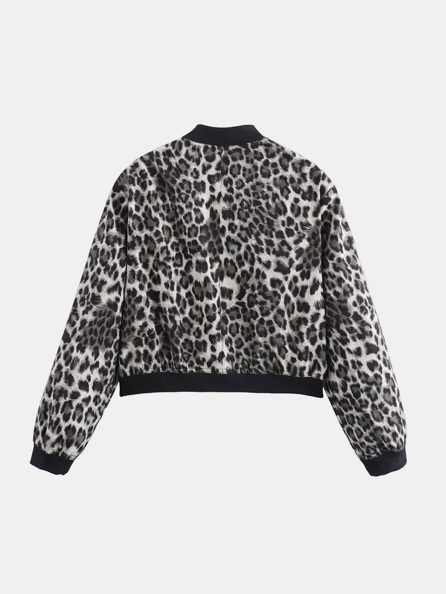 Boxy bomber jacket in leopard print with black ribbed collar, cuffs, and hem.