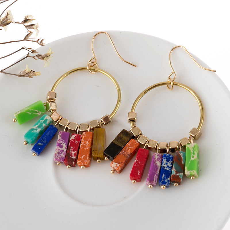Rainbow stone hoop earrings with multicolor stone dangles and gold-tone alloy hoops.