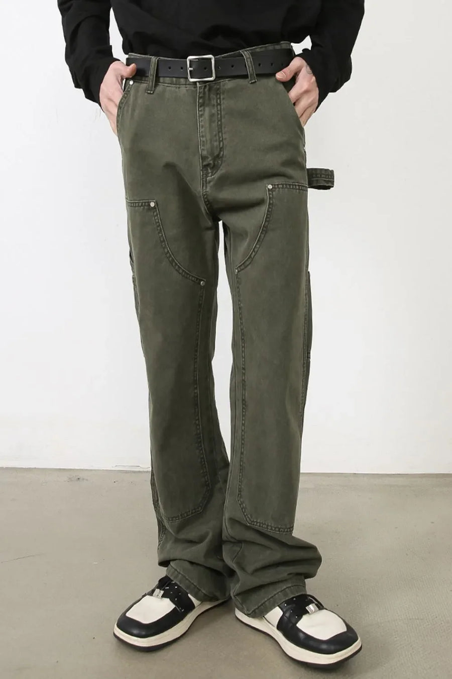 Army green wide-leg jeans with utility pockets and a relaxed fit.