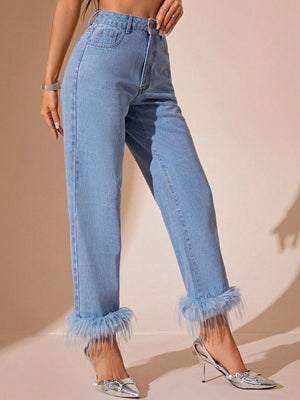 Light wash denim jeans with feather trim cuffs and high-rise waist.