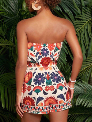 Print strapless ruched romper in multicolor floral pattern with elastic waist detail.