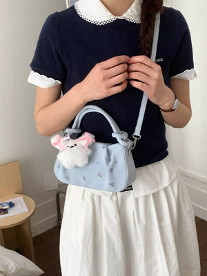 crossbody bag in light blue featuring ruched and structured fit