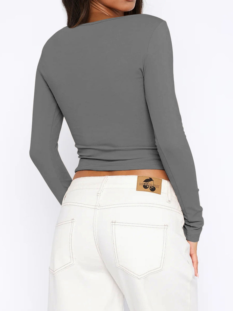 Gray ribbed button-down crop top with long sleeves.