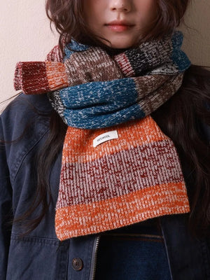 Textured wool color block scarf with orange, blue, brown, and red stripes.