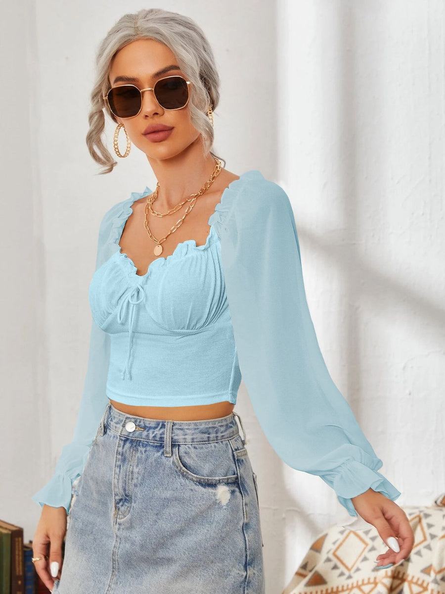 Pastel blue bustier blouse with tie front and ruffled sheer sleeves