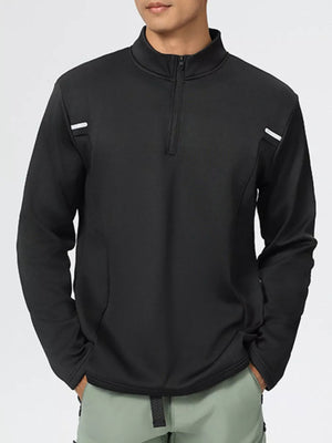 Black half-zip sweatshirt with white shoulder detail and mock neck.