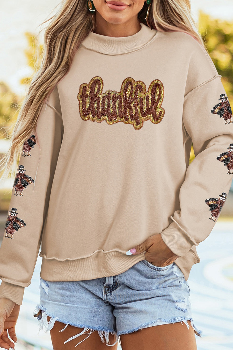 65% polyester, 35% cotton Care instructions: Machine wash cold sweatshirt in beige with relaxed silhouette