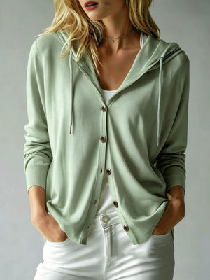 cardigan in sage green featuring buttoned and relaxed fit