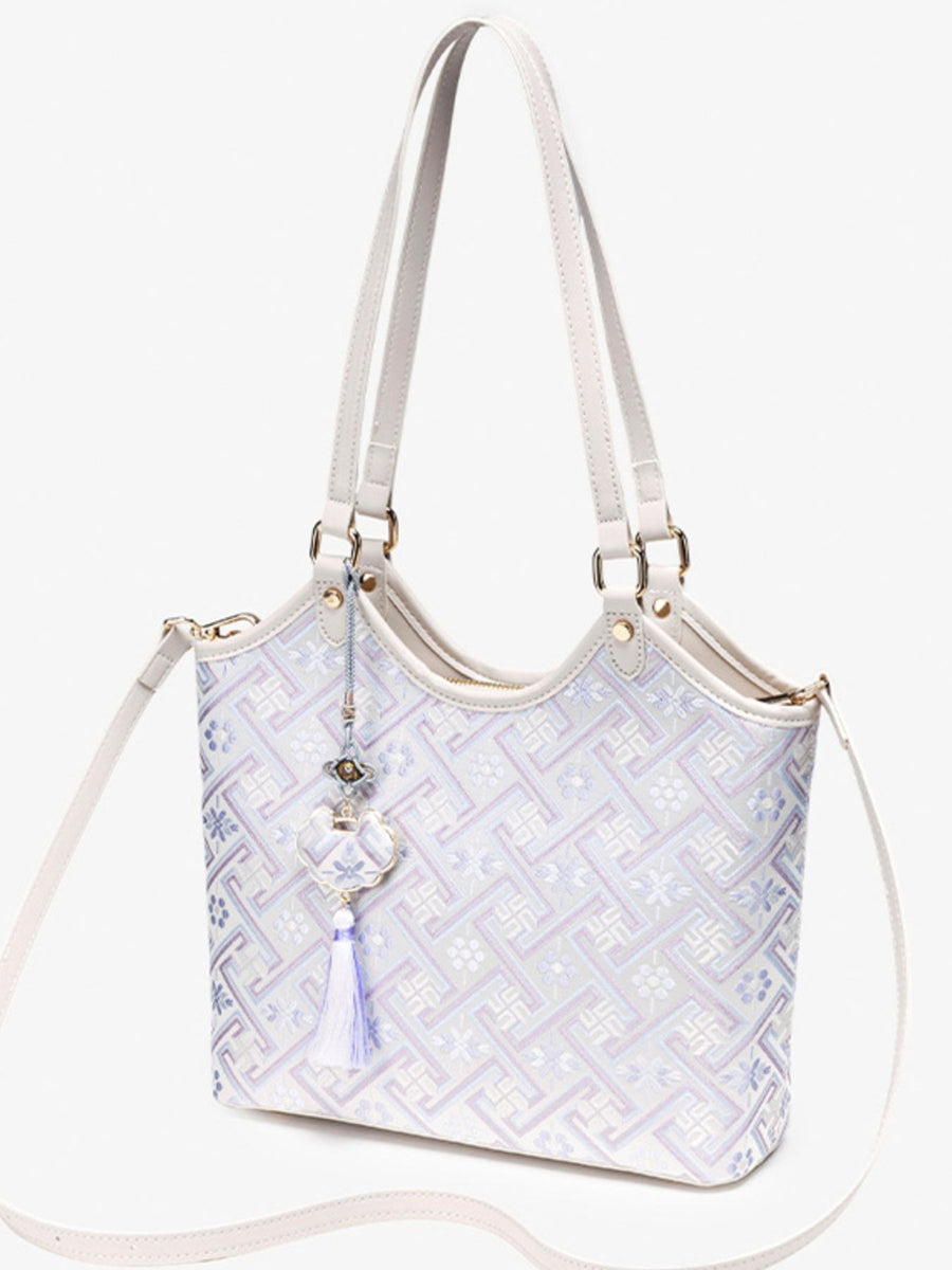 shoulder bag in lavender with geometric and shoulder straps
