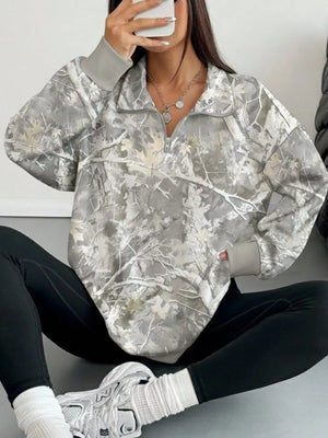 white sweatshirt featuring zipper and camo