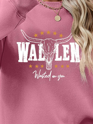 Blush Pink Western Graphic Sweatshirt with bull skull and stars graphic.