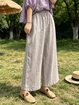 Maternity pants in khaki with drawstring waist and pockets, ankle-length wide leg
