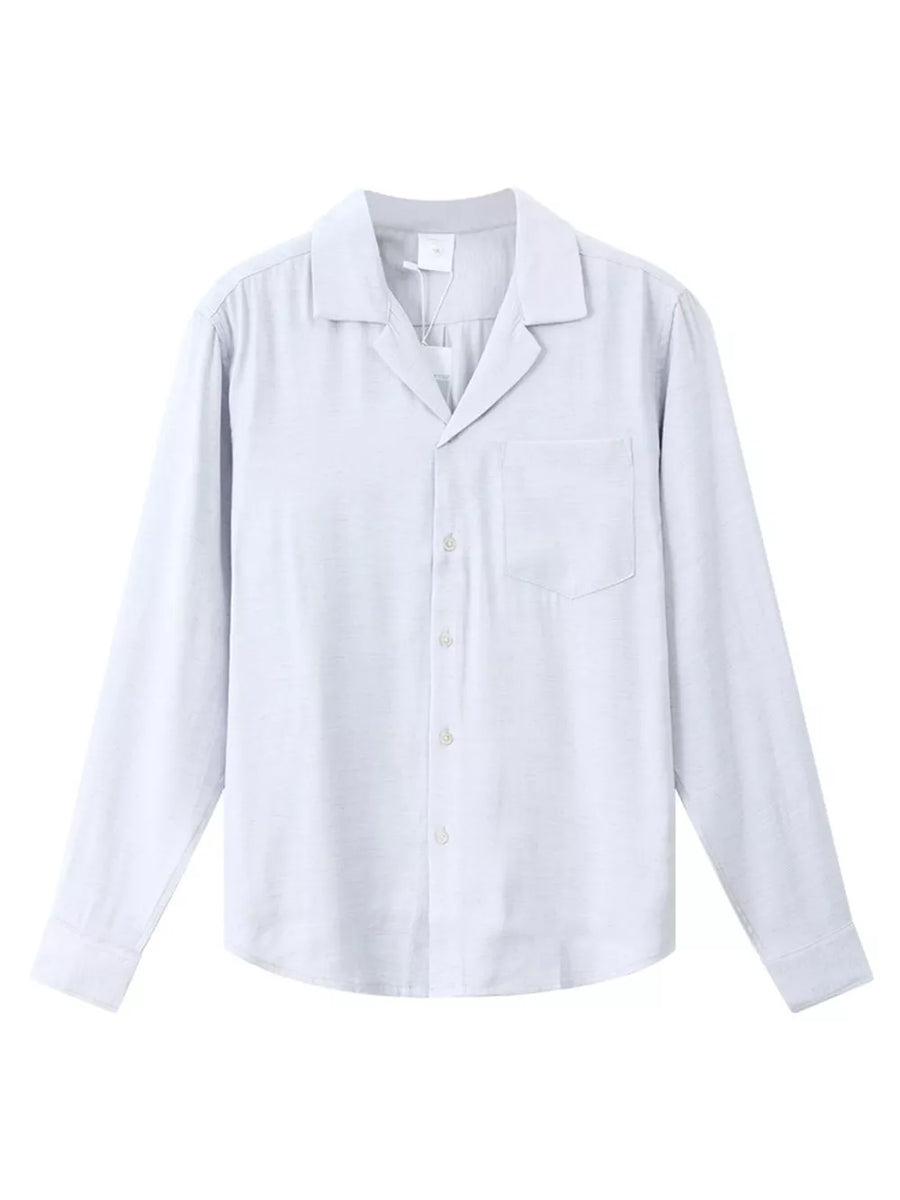 Relaxed camp collar button-up shirt in light blue with a chest pocket and buttoned cuffs.