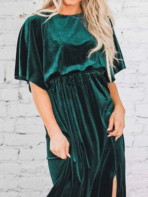 Green velvet maxi dress with flutter sleeves and cinched waist