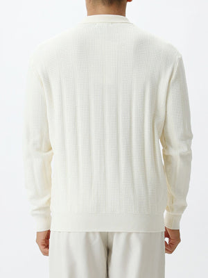 White zip-up sweater with hip-length and quarter-zip