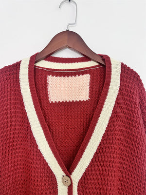Red knit v-neck cardigan with cream trim and one button