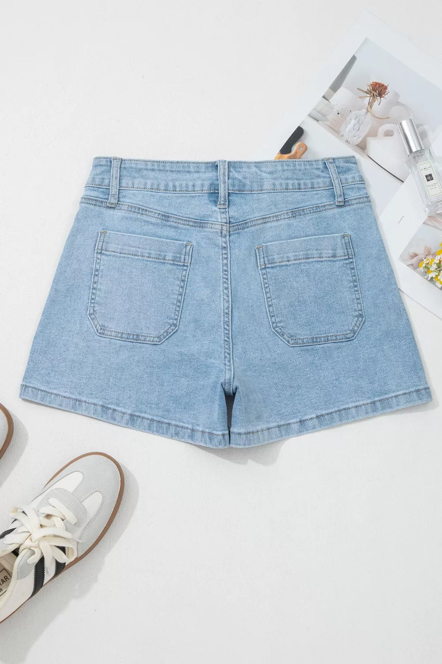 Light wash denim shorts with high rise and patch pockets
