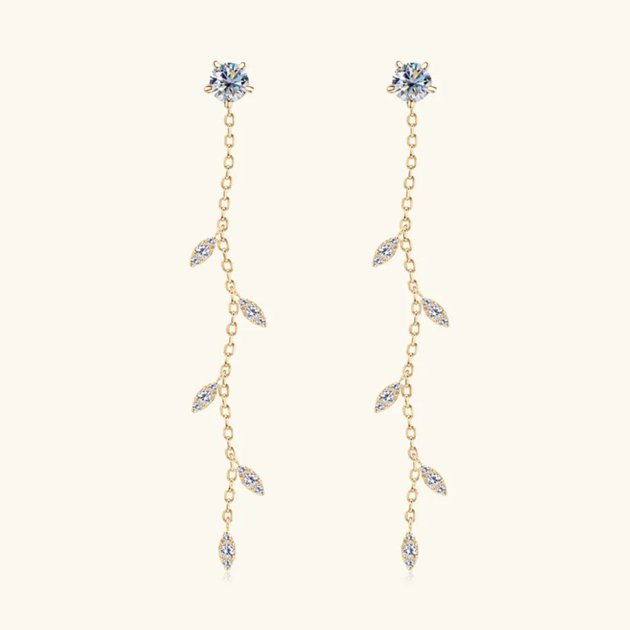 Gold dangling crystal vine earrings with delicate leaf-shaped accents.