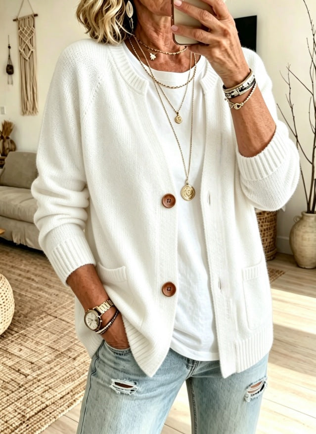 cardigan in white featuring buttoned and relaxed fit