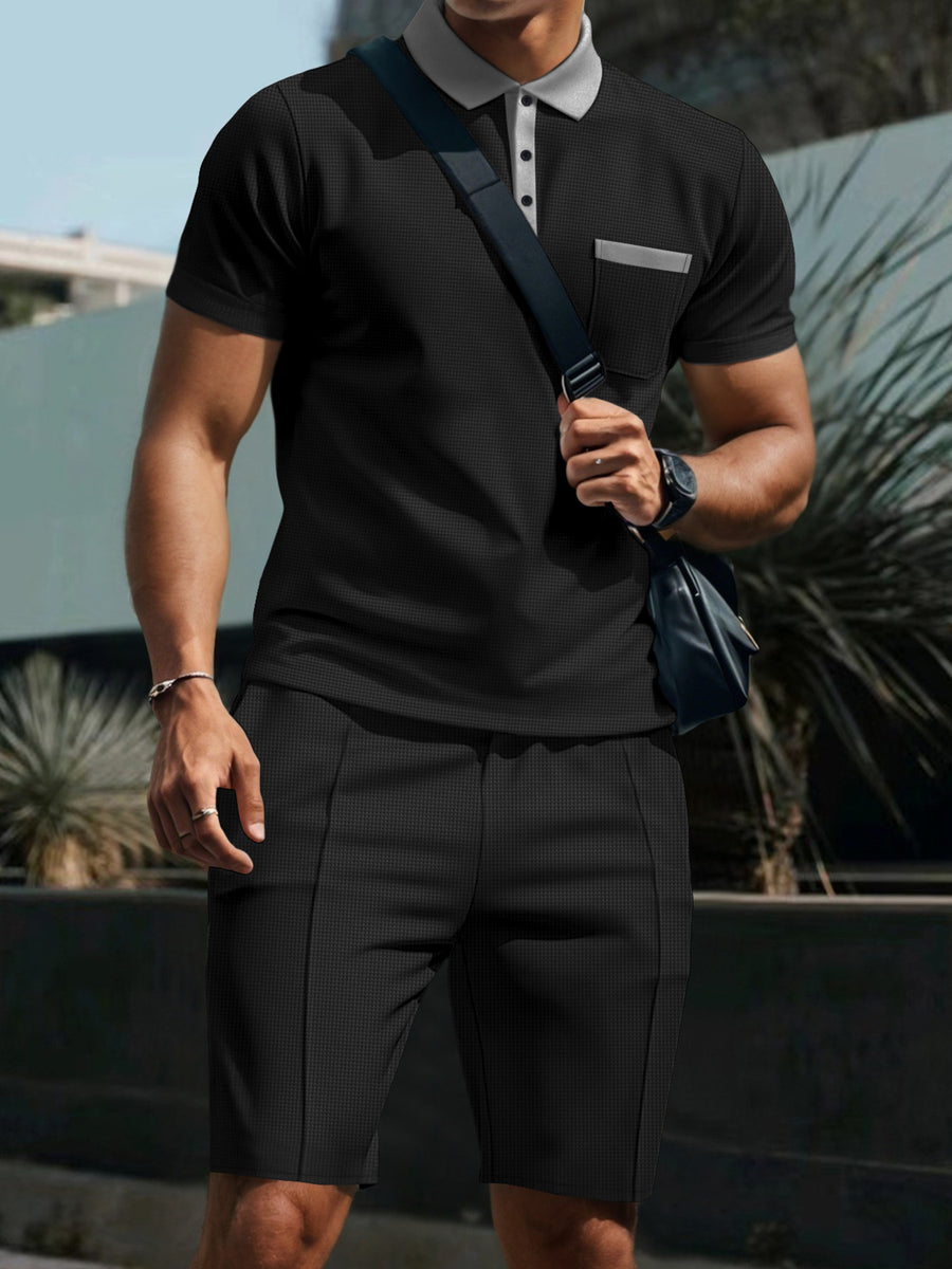 Black polo shirt and shorts set with grey collar and pocket detail