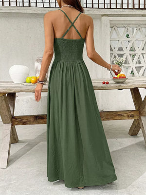 Green cotton blend maxi dress with spaghetti straps and smocked bodice.