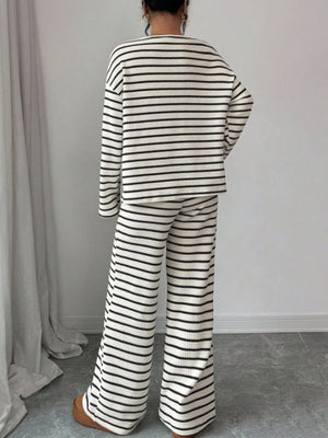 100% polyester Care instructions: Machine wash cold Top and Pants Set in White with relaxed silhouette