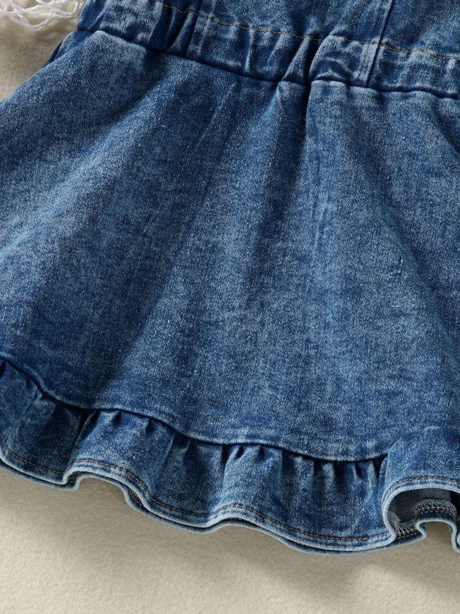Adjustable denim overall dress for kids with ruffled hem and elastic waistband.