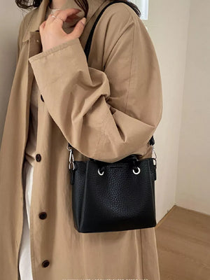 black crossbody bag with adjustable strap and N/A