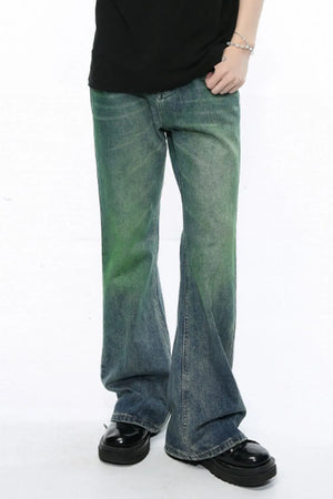 Ombre flare denim trousers in medium wash with green gradient detail, cotton composition, flared leg.