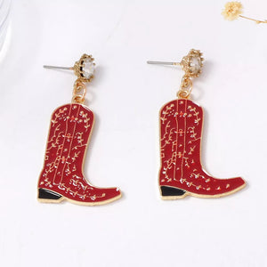 earrings in gold with ornate and dangle