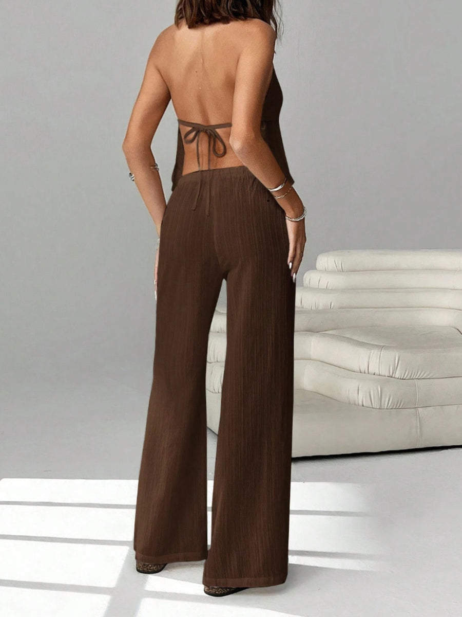 Brown halter neck cami and relaxed fit pants set with drawstring waist.