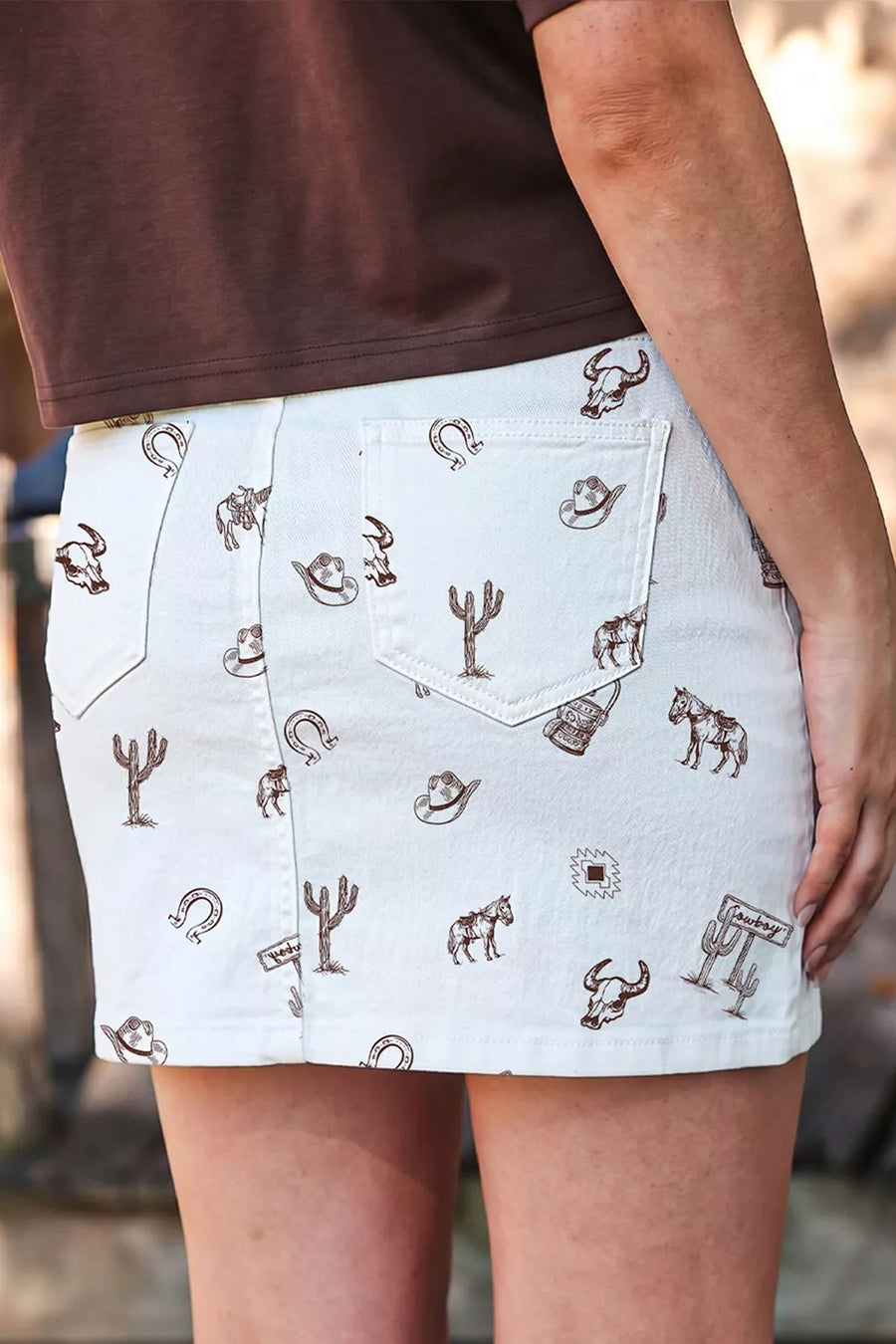 White mini skirt featuring pocketed and western-print