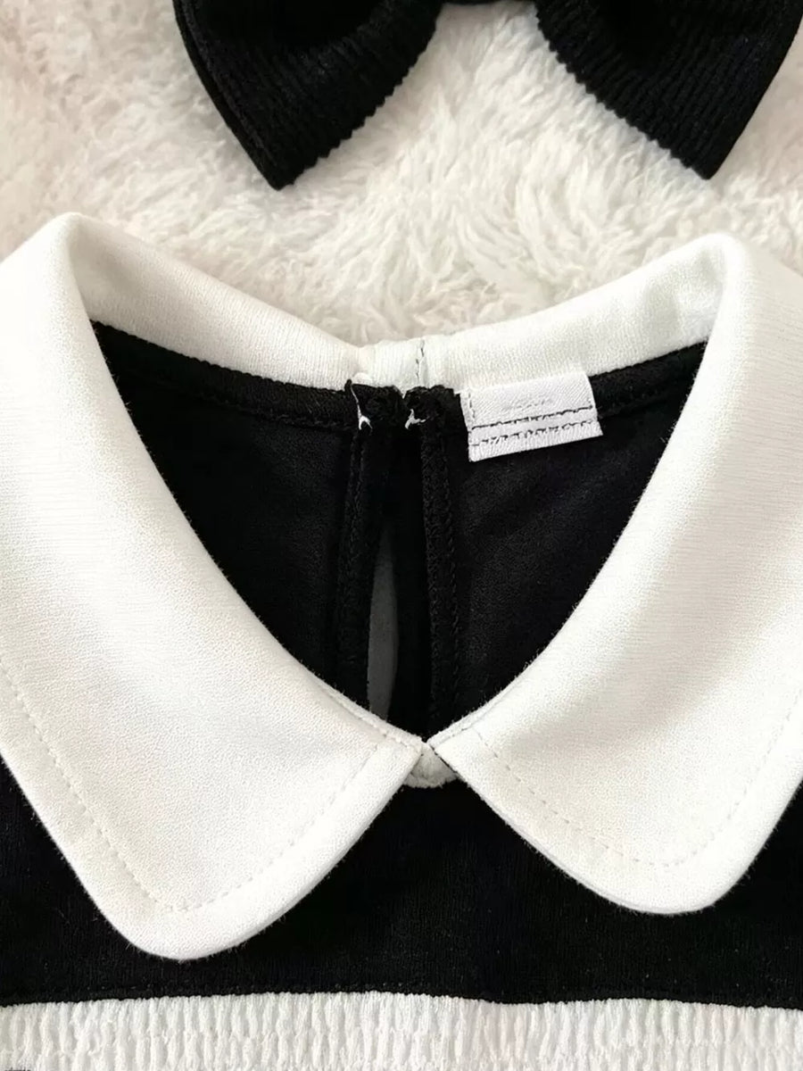 white bodysuit featuring ruffled and graphic print