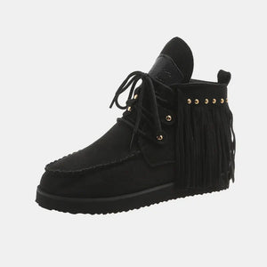 Black fringed moc-toe ankle boots with lace-up front and studded detail.