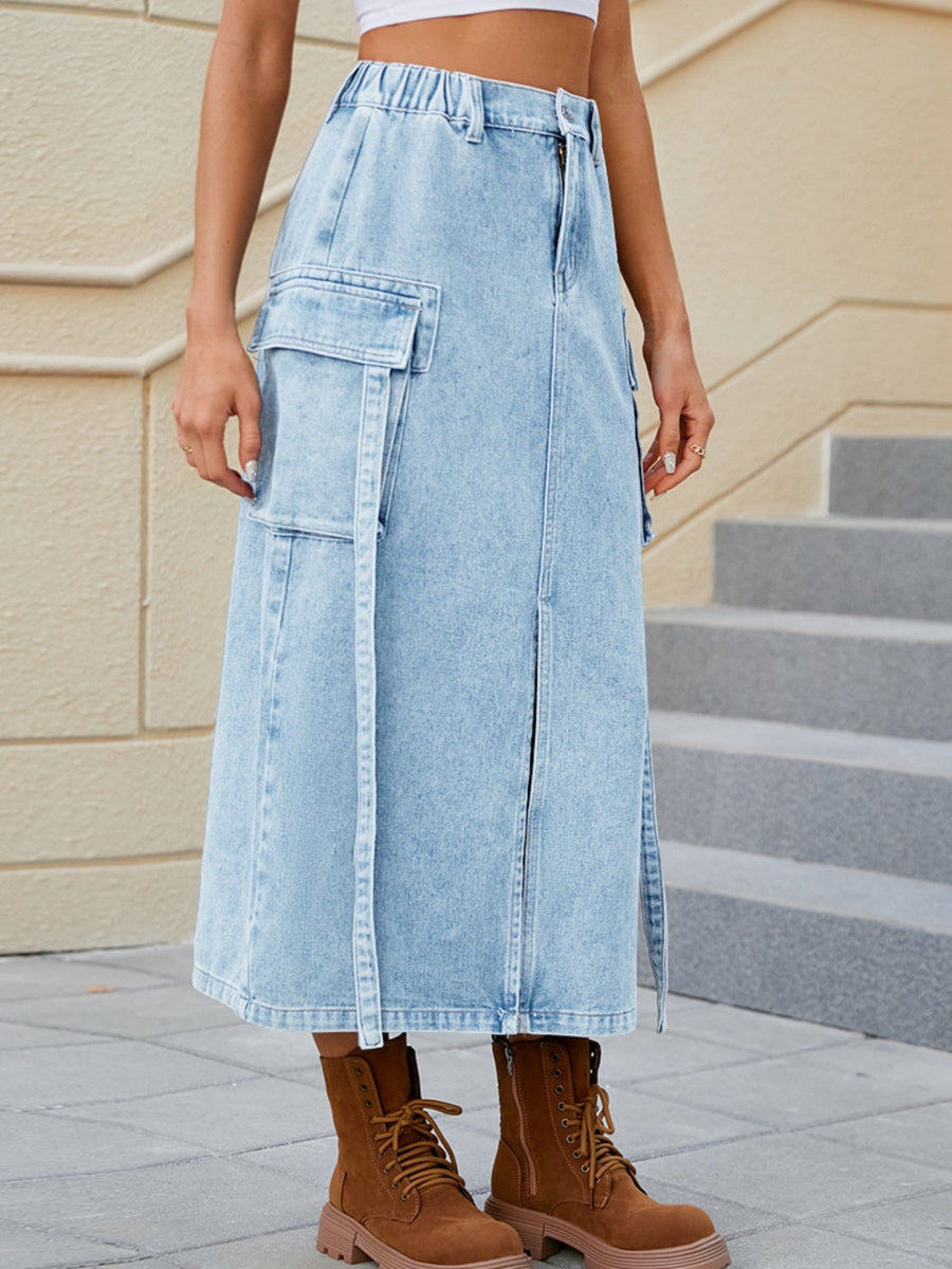 Light blue denim midi skirt with cargo pockets and front slit detail.