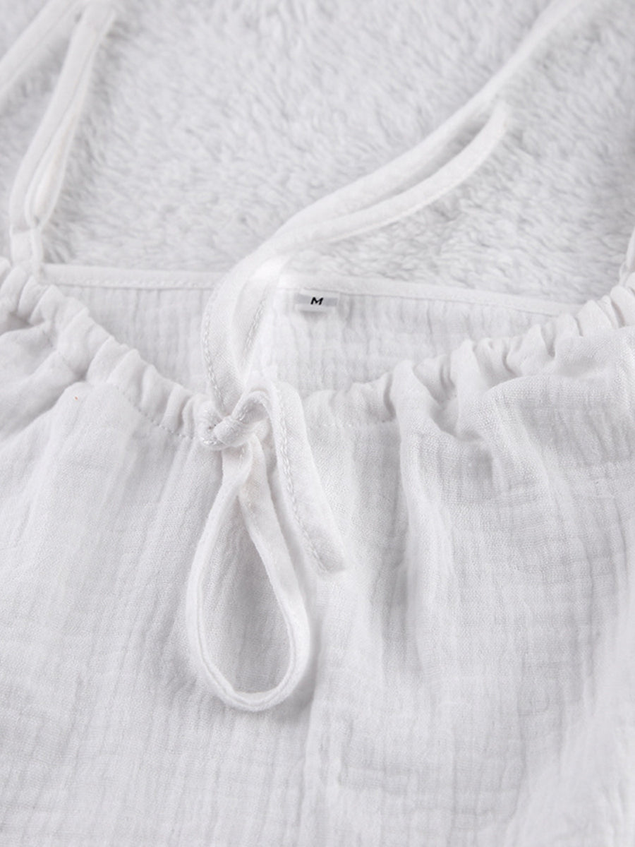 White cotton cami pajama top with adjustable tie detail and spaghetti straps