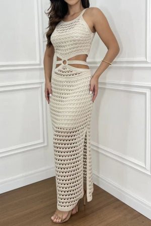 Beige crochet cutout maxi set with a halter neckline and high slit.