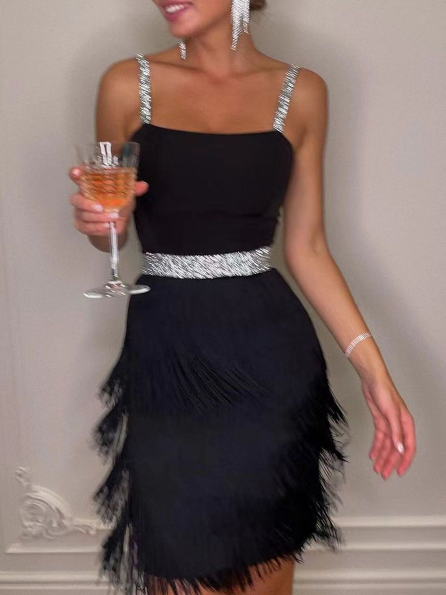 Black cami mini dress with fringe trim and sparkling straps and waist.