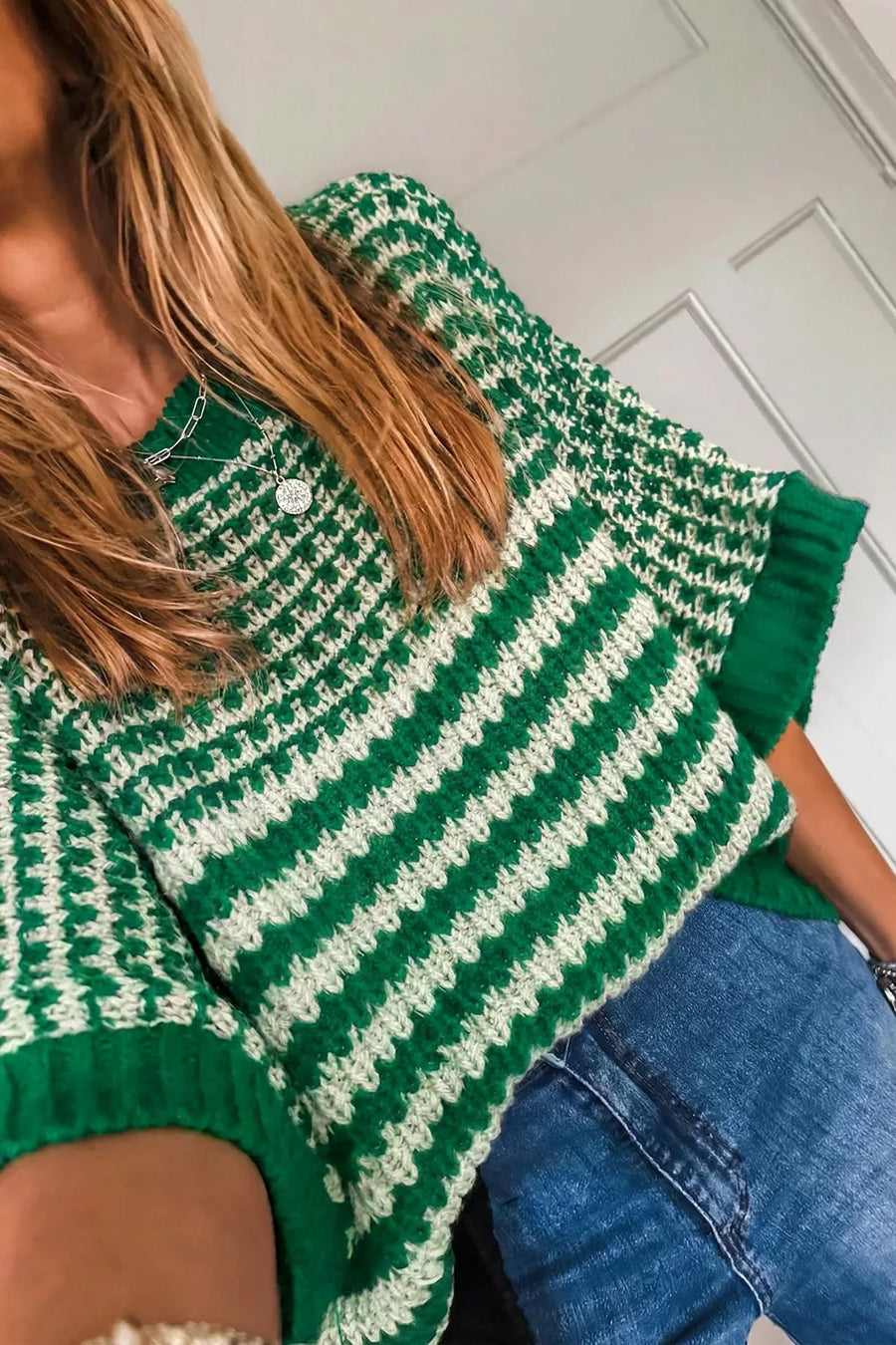 ivory pullover sweater featuring stretch and striped