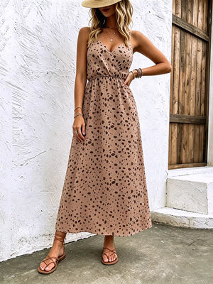 Taupe spaghetti strap midi dress with adjustable straps and a dalmatian-like print.