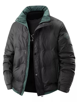 Black padded puffer jacket with green collar and lining, featuring a zip and button closure.