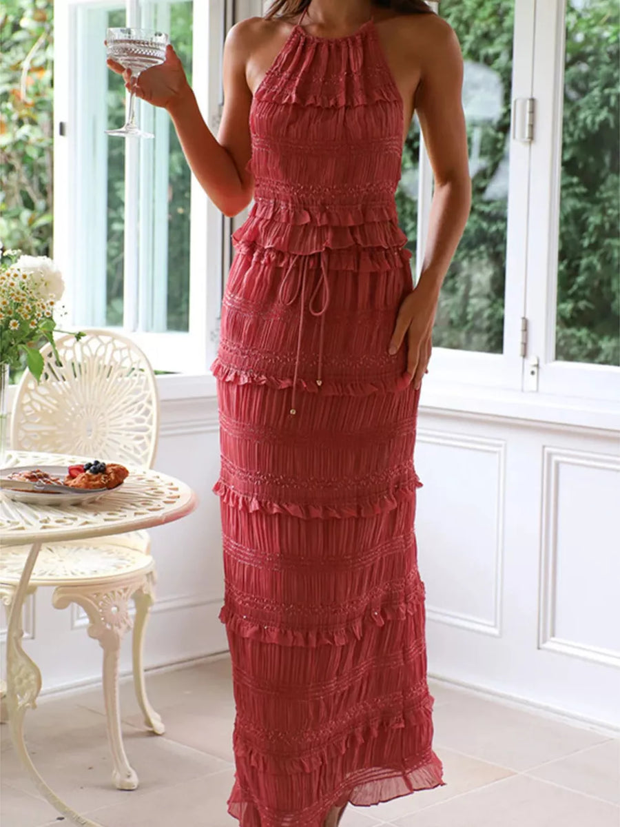 Brick-red halter neck smocked tiered maxi dress with drawstring waist.