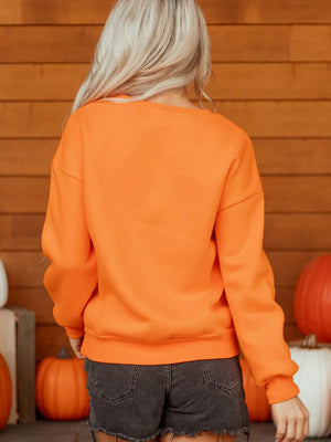 50% polyester, 50% cotton Care instructions: Machine wash cold crewneck sweater in orange with regular silhouette