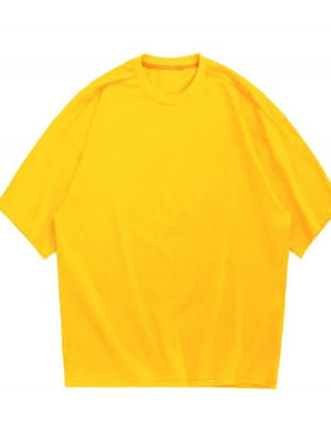 Oversized gold crew neck t-shirt with textured fabric and short sleeves.