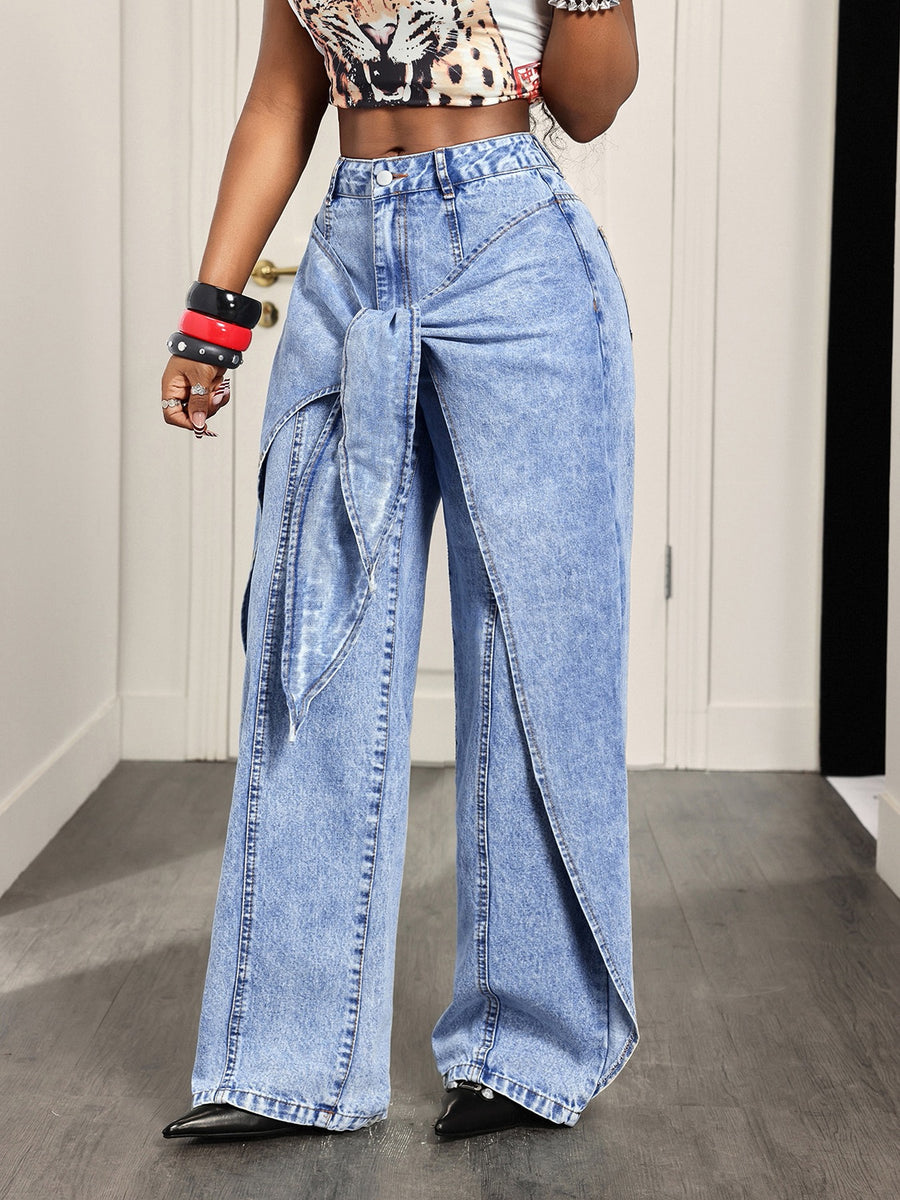 85% cotton, 15% polyester Care instructions: Machine wash cold wide-leg jeans in Blue with flared silhouette