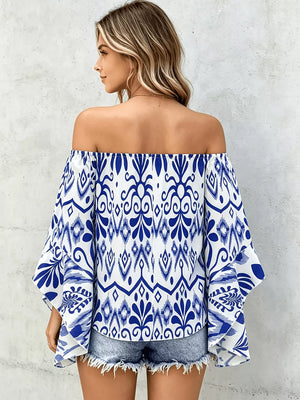 off-shoulder top in Black with smocked and hip-length
