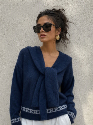 cream pullover sweater with ribbed cuffs and long sleeve