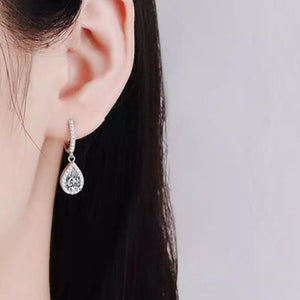 earrings in clear with moissanite stones and 0.6 inches