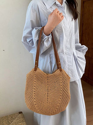Brown shoulder bag featuring crochet knit construction and chevron